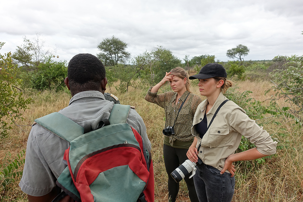 Christory, Bushwhacked - Elise and Paola listen intently to Sinhle's briefing.
